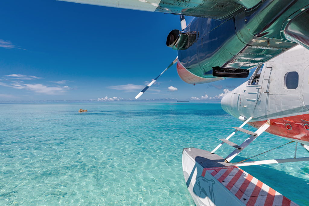 Travel from one Maldivian island to the next in a boat plane.