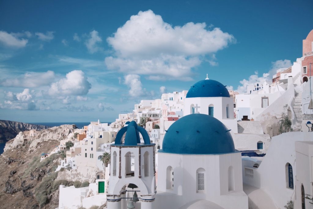 Nestled into the cliff, Santorini cave houses offer a breathtaking experience