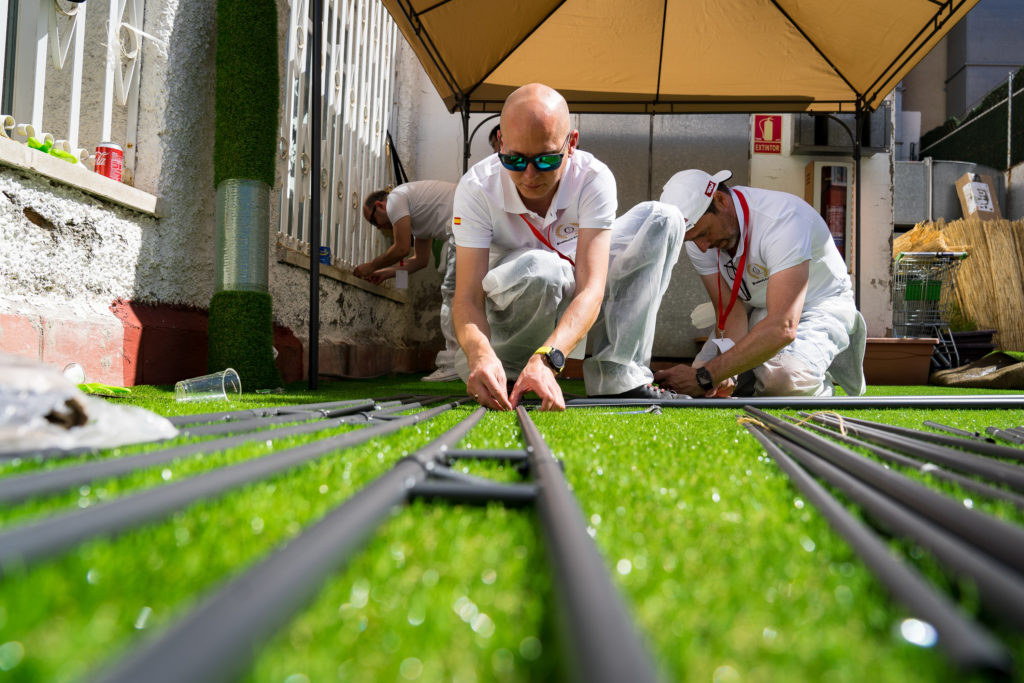Madrid, men assembling patio for an event