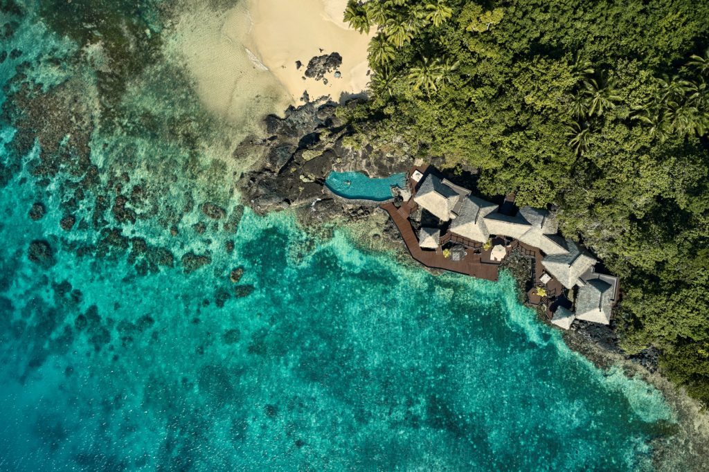 Como Laucala, isle of black basalt rock ringed with beaches and coral reefs