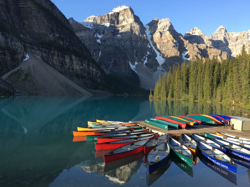 Moraine Lake's brilliant blue-green waters are sheltered in the Valley of the Ten Peaks