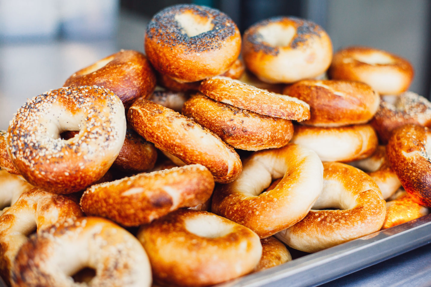 Close-up of freshly baked bagels with seeds on top