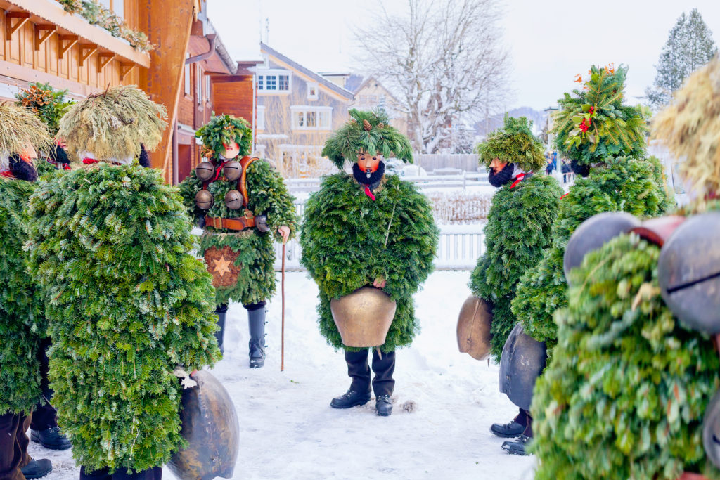 Festive New Year's Eve celebrations in the canton of Appenzell Ausserrhoden, Urnasch, Switzerland, featuring locals adorned in traditional costumes