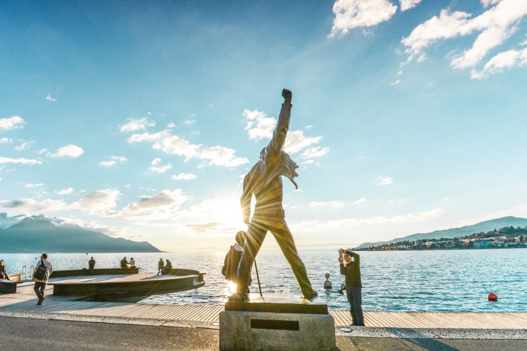 In Montreux, Vaud, Switzerland, the Freddie Mercury memorial statue on the shores of Lake Geneva is bathed in the warm glow of the sun.