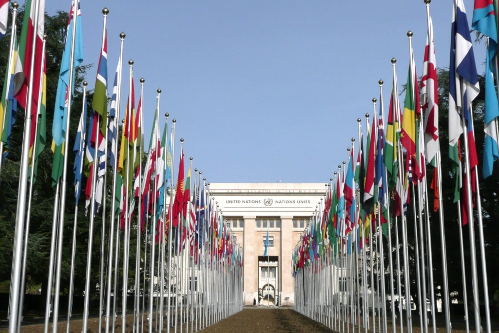 The United Nations buildings and flags stand prominently in Geneva, Switzerland.