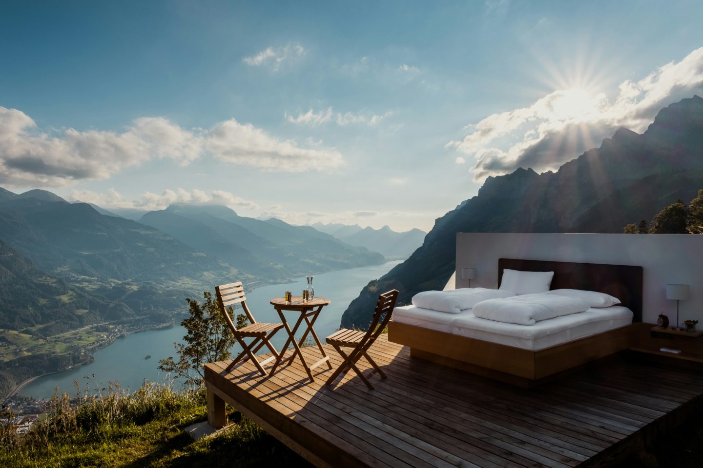 A bed placed outdoors offers a serene setting with a captivating view of Lake Wallensee. Switzerland