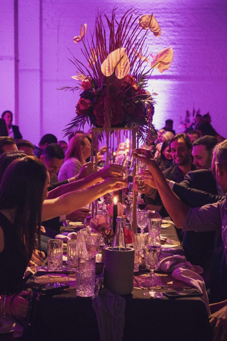 Guests toast together during the evening of an event in Berlin.