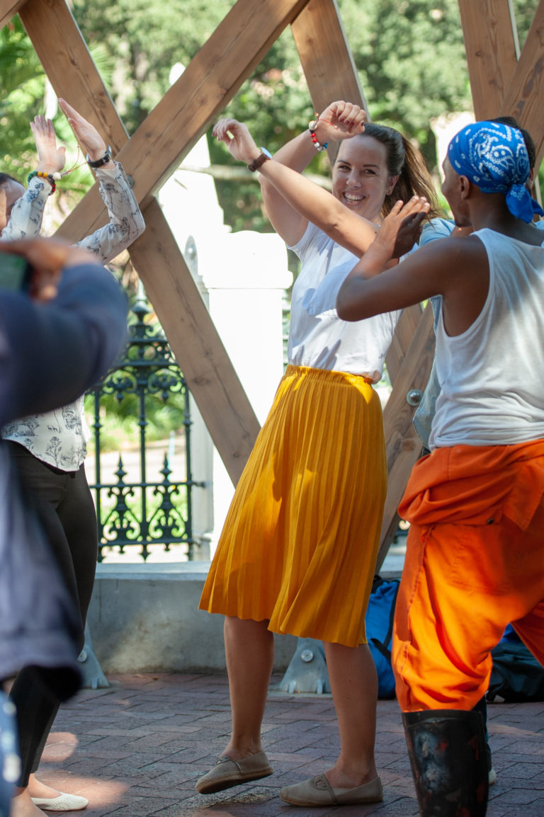 A lady dancing with colleagues in Cape Town.