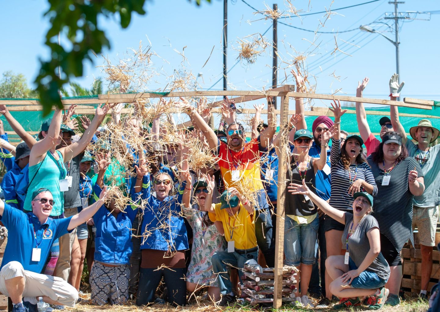 A group of people cheer after the successful completion of the CSR project in South Africa.