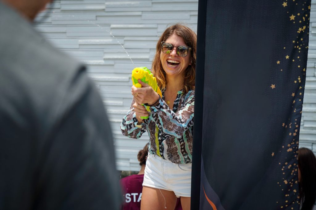 Our innovative approach can be seen here with Nina spraying with a water gun during an event.