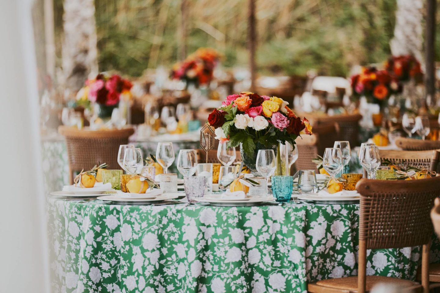The table shows beautiful decoration with flowers and lemons at a birthday dinner during a private event in Puglia, Italy.