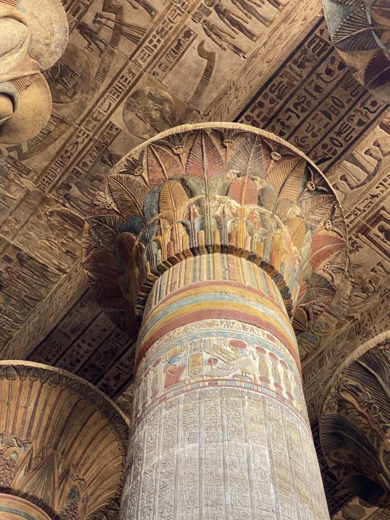 The photo shows beautiful details of a column with Egyptian murals.